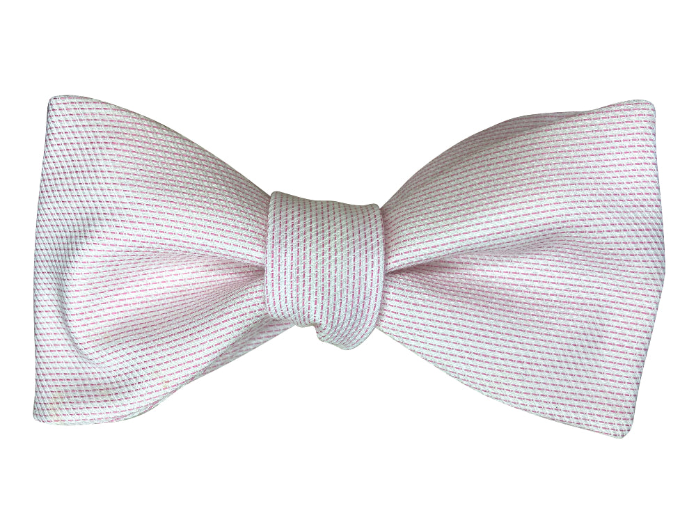 bow tie made of textured fabric with a fine  stripe pattern in light pink and white