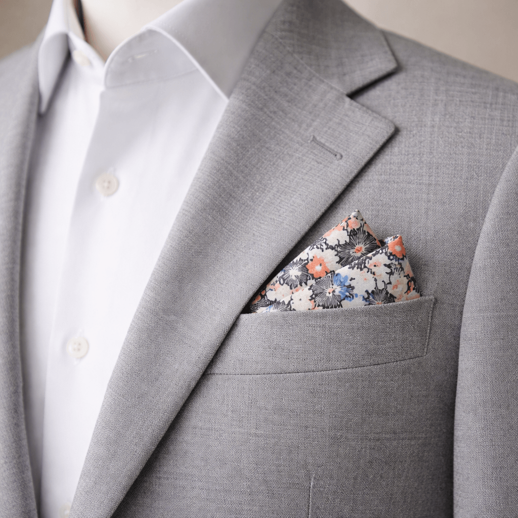 floral sketch pocket square in coral blue and black in grey blazer pocket