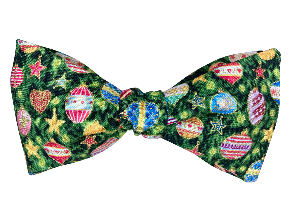 colourful christmas baubles on green self tie bow tie