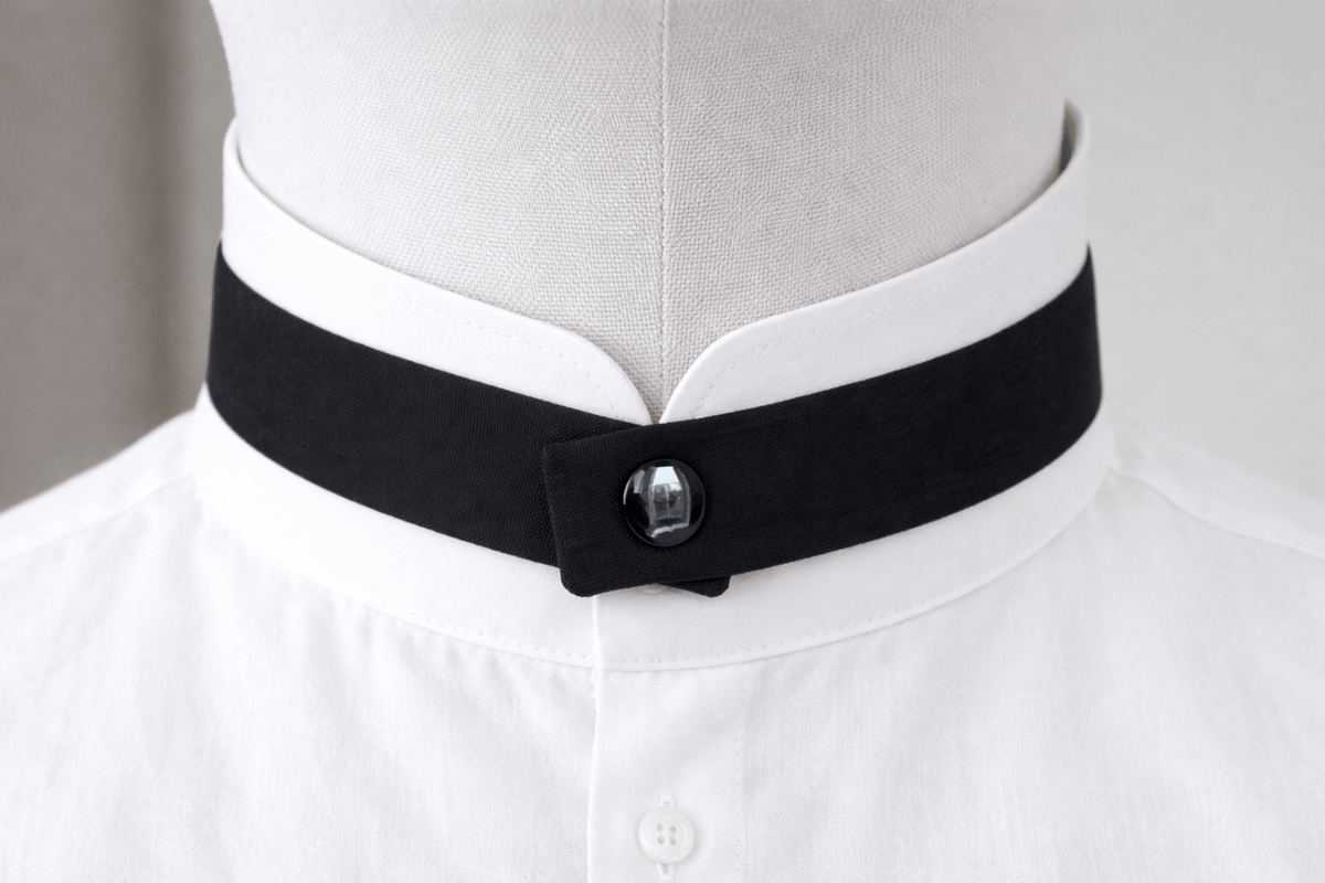 modern continental crossover black silk tie with black pop stud on a mandarin shirt collar
