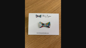 video showcasing Blue Eyes Bow Ties enamel pin