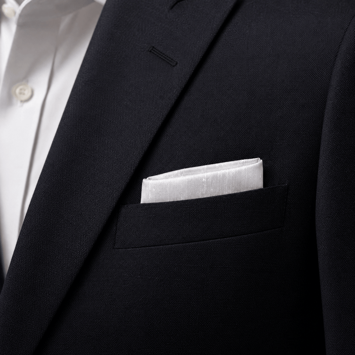 white silk pocket square in blazer