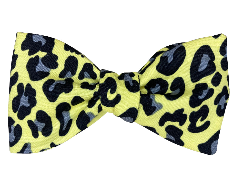 Yellow self tie bow tie with black and gray leopard print pattern
